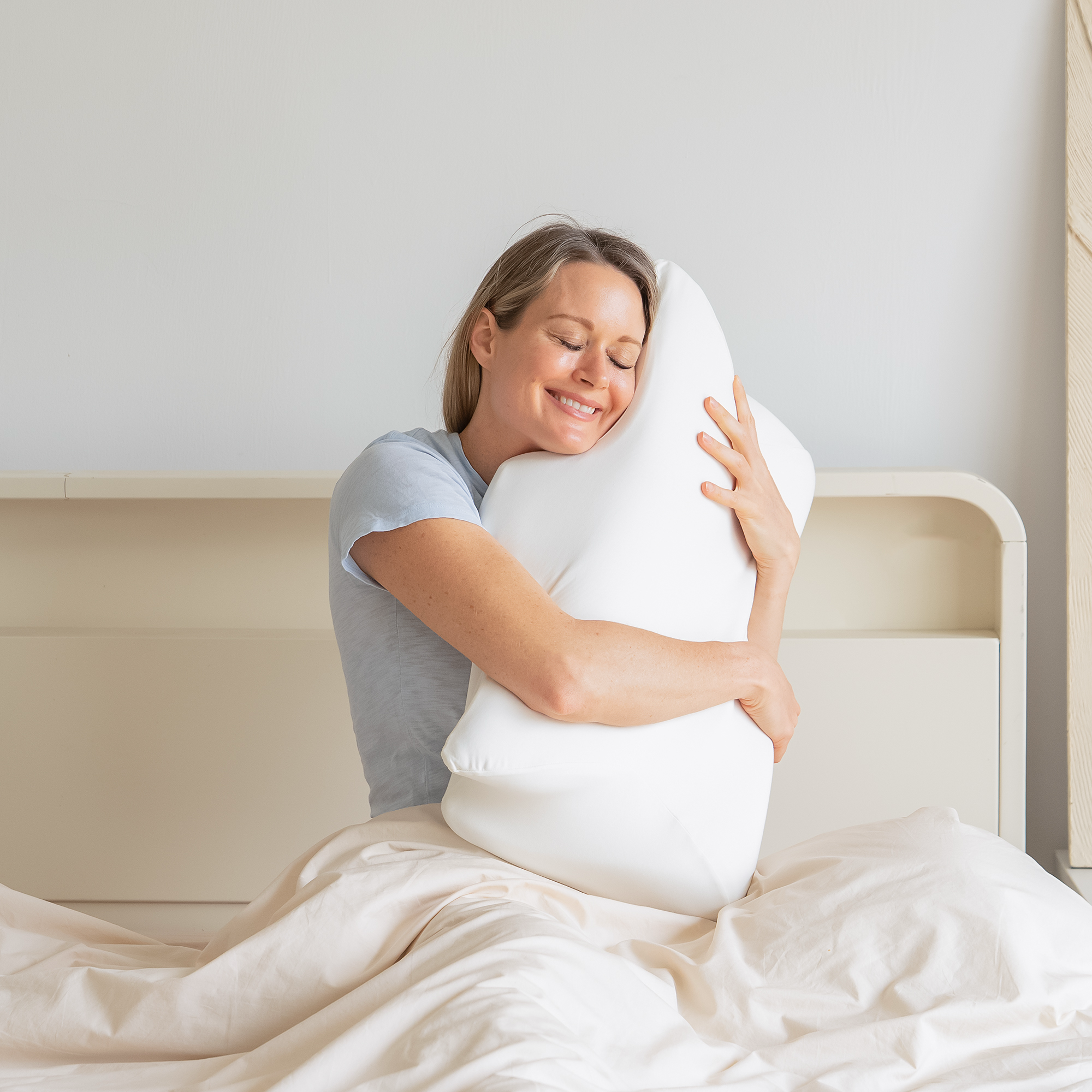 Woman hugging pillow